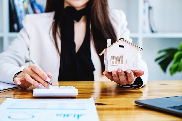Newcomer family reviewing mortgage documents with an advisor